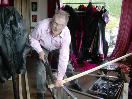 Cutting the 2 x 4s ready to staple the velvet Cutting the 2 x 4s ready to staple the velvet